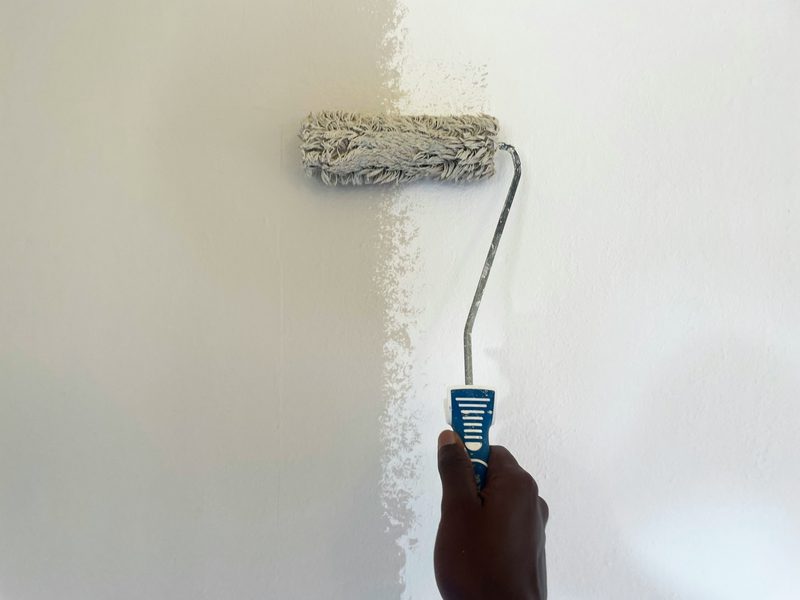 Paint roller on a wall